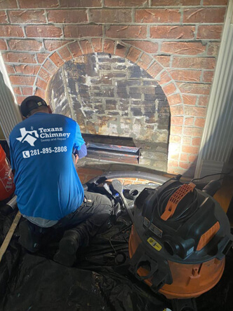 Chimney cleaning photograph published on Texans Chimney's website